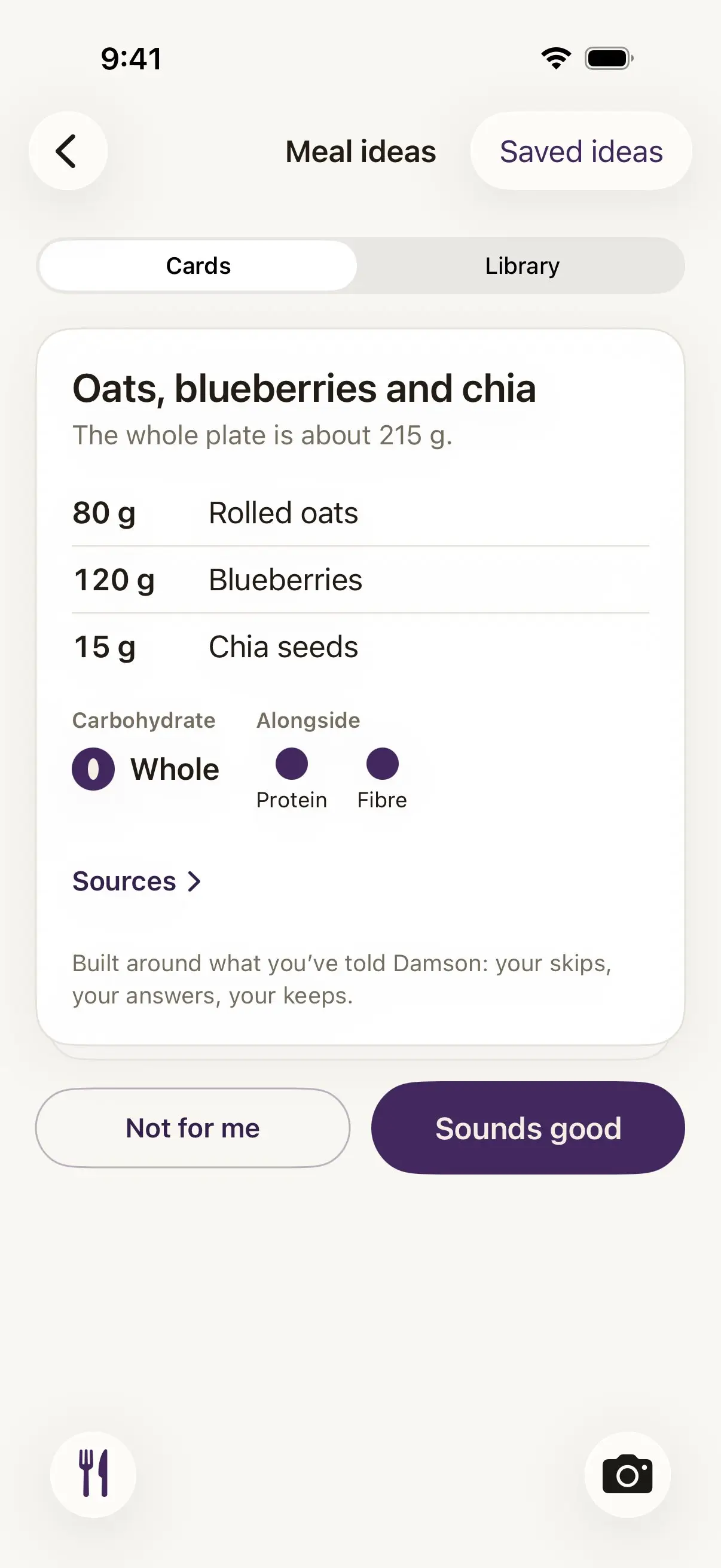 Damson's Meal ideas screen with Cards and Library tabs and Saved ideas. The card reads oats, blueberries and chia, the whole plate is about 215 g, with 80 g rolled oats, 120 g blueberries and 15 g chia seeds, the carbohydrate marked whole with protein and fibre alongside, a Sources link, and the line built around what you've told Damson: your skips, your answers, your keeps. Below, Not for me and Sounds good.