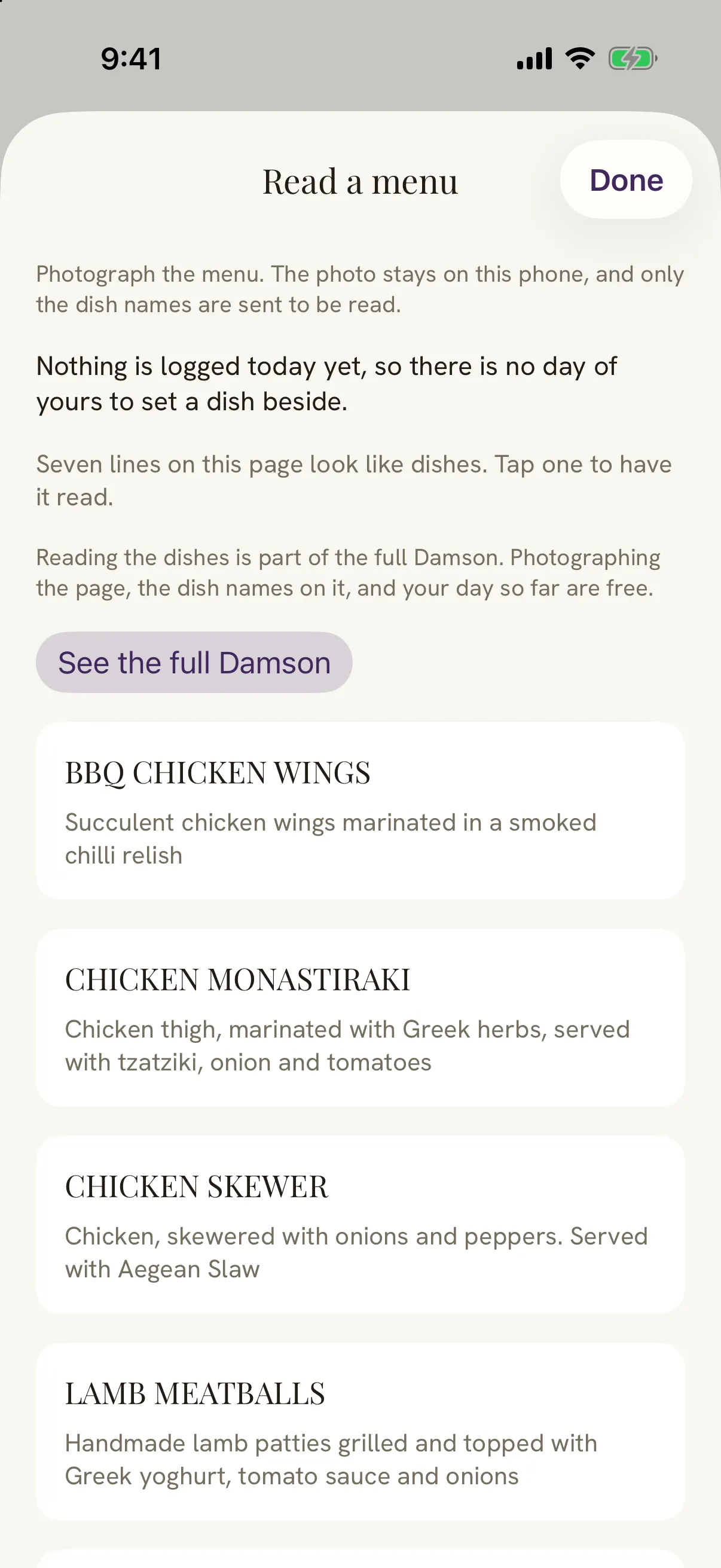 Damson's Read a menu screen after photographing part of a restaurant menu. Seven lines look like dishes, among them BBQ chicken wings, chicken monastiraki, chicken skewer and lamb meatballs, each with its description underneath. A note says the photo stays on this phone and only the dish names are sent to be read.
